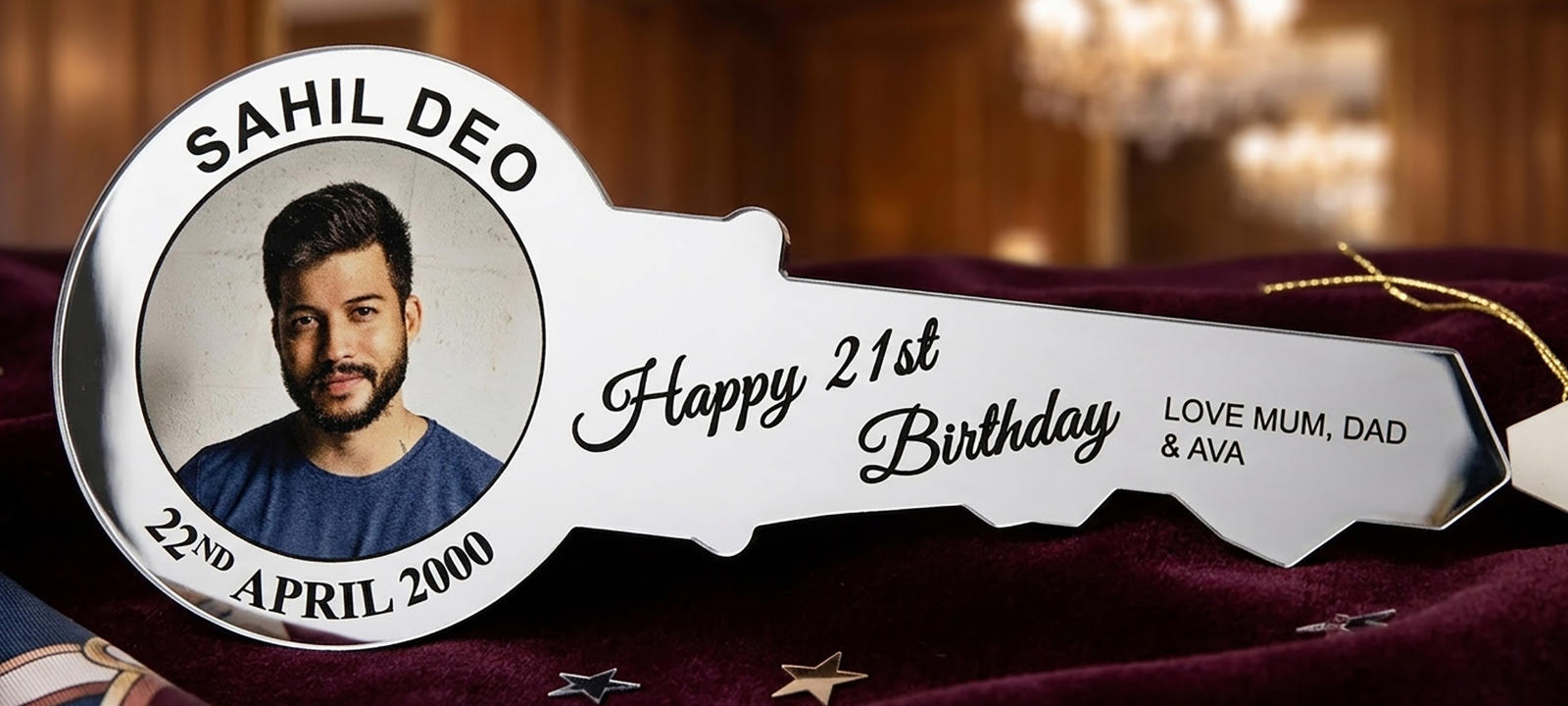 Custom 21st birthday key made from 3mm silver mirror acrylic and 6mm wood backing with an attached zinc chain, showing a personalised photo and name.